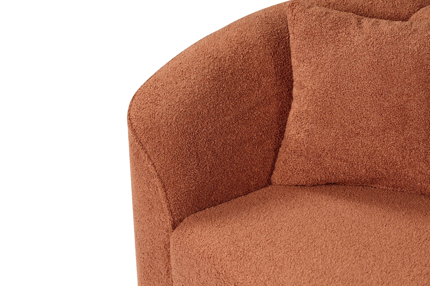 Close-up of contemporary sloped arm boucle upholstered sofa in warm rust color, showcasing soft texture and plush cushion.