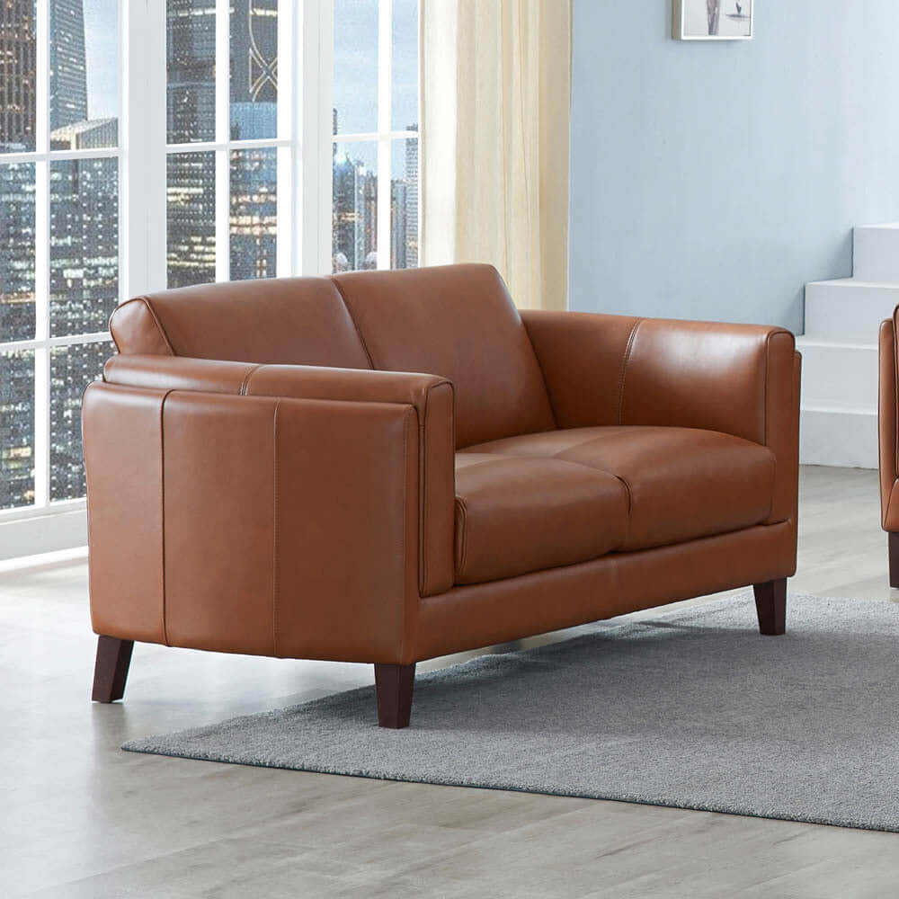 Maui MCM Top-Grain Leather Sofa Loveseat 64' in brown leather stylishly set in a contemporary living room.