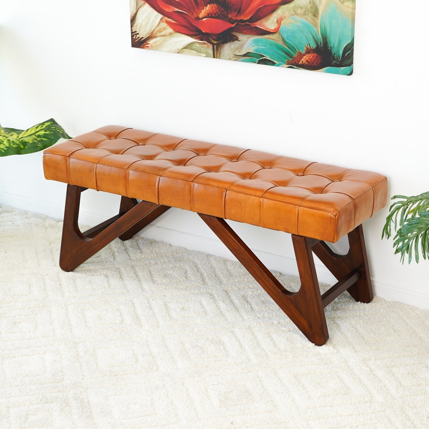 The Ashcroft Furniture Co. Mia Tufted Leather Wood Base Bench 47 features genuine leather upholstery and a dark wood base, bringing mid-century modern charm to your home décor.