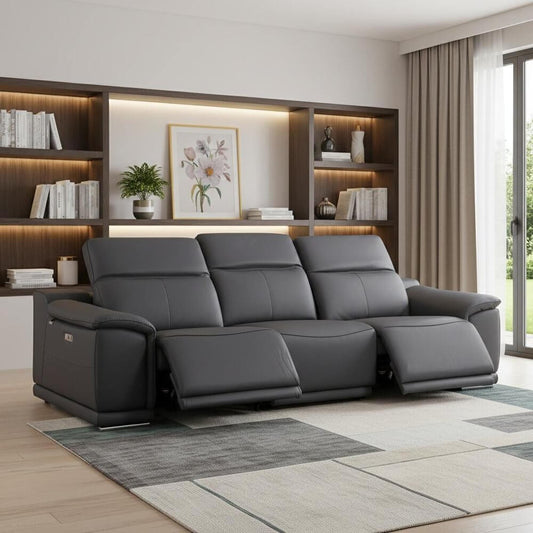 107" Camel Italian Leather Reclining Metal USB Sofa in modern living room with shelves and greenery.
