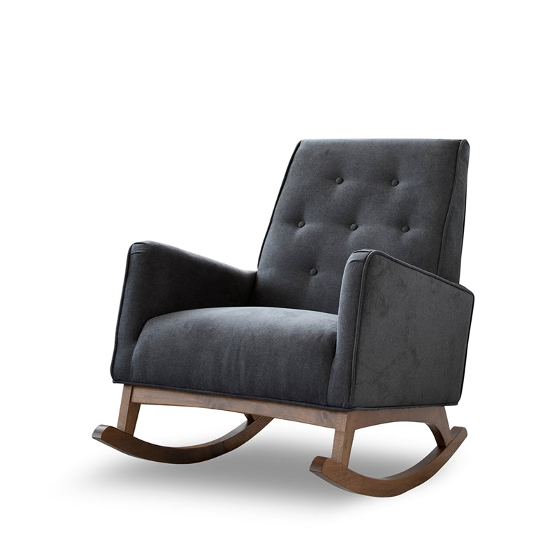 The Ashcroft Furniture Co Demetrius Tufted Fabric Solid Wood Rocking Chair features a modern dark gray tufted design with a button-tufted backrest and solid wood rockers, displayed against a plain white background.