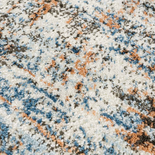 Close-up of vibrant abstract multi-color area rug featuring blue, orange, and beige hues, ideal for modern decor.
