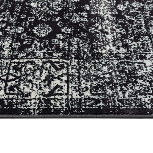 Distressed Vintage Persian Styled Woven Area Rug detail, showcasing intricate patterns in black and white.