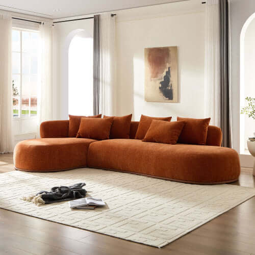 Rounded L-Shaped Chaise Sofa Sectional in vibrant orange fabric, plush cushions, ideal for modern living spaces.