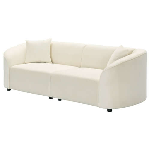 Contemporary sloped arm boucle upholstered sofa in cream color with plush cushions and sculptural design.