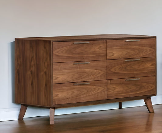 The Home Roots MCM Solid Wood Six-Drawer Double Dresser 51 features sleek metal handles and angled legs, adding mid-century style against a light wall on a hardwood floor.