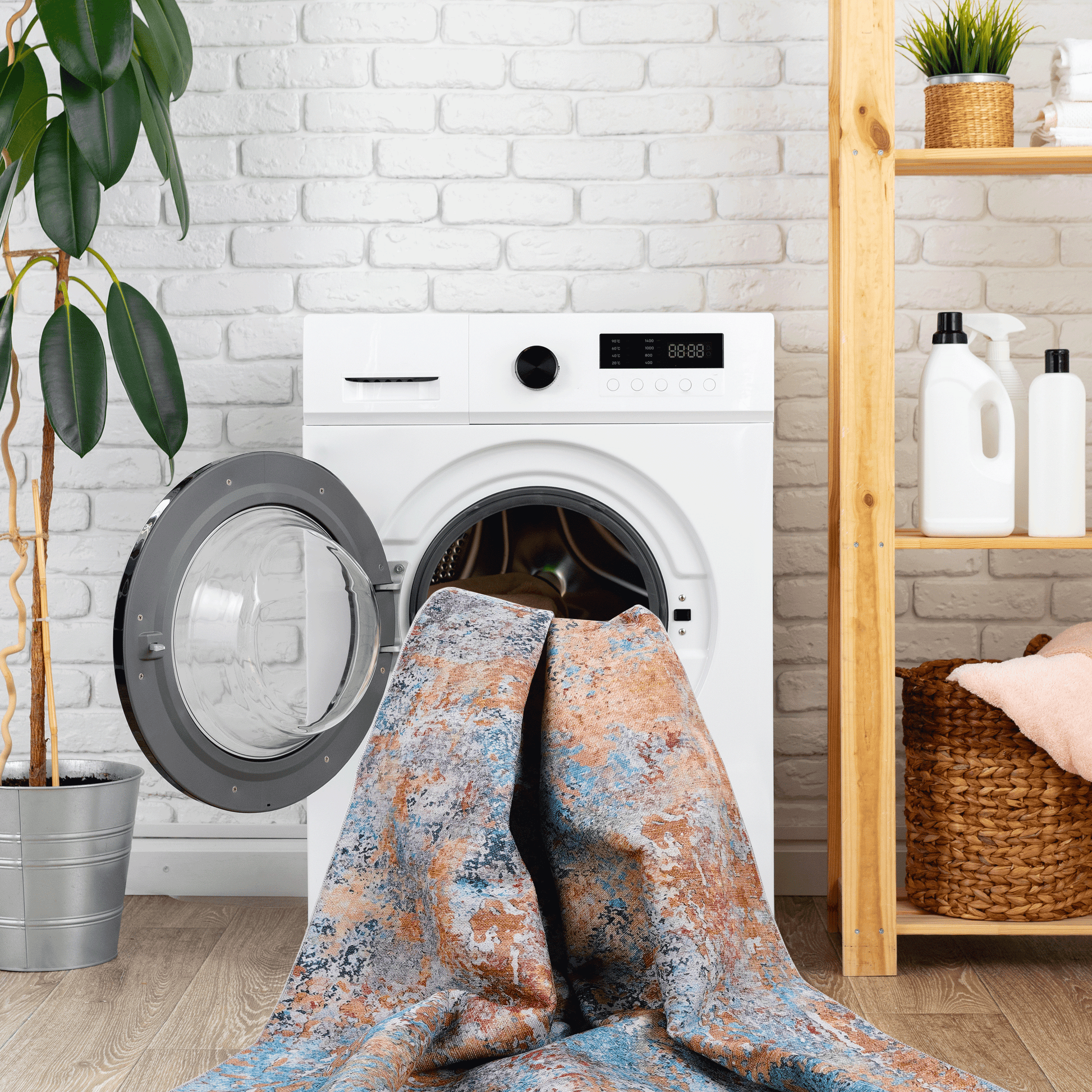Multi-colored abstract accent rug in a washing machine, showcasing its washable convenience and vibrant design.