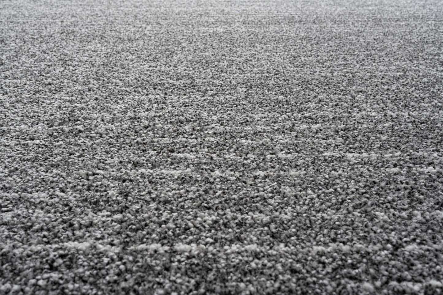 Lydia Rectangular Gray & White Striped Polypropylene Area Rug (3 Sizes) texture close-up showing plush fibers and contemporary design.