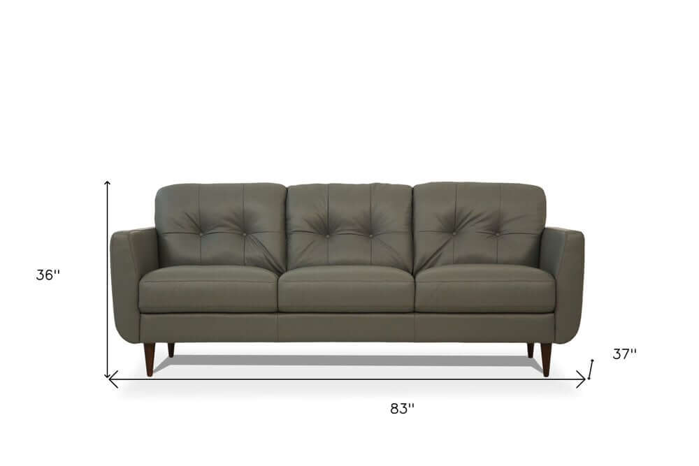 83" Green Leather Sofa With Black Legs featuring a plush tufted design and measurements of 83" x 36" x 37".