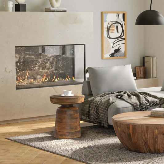 Robbie Wood Accent End Table in a cozy living room setting with fireplace, showcasing natural wood design.