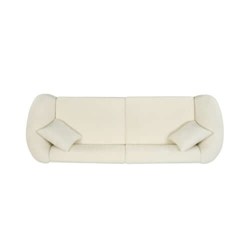 Contemporary sloped arm boucle upholstered sofa in cream with two matching cushions, elegant design for modern living spaces.