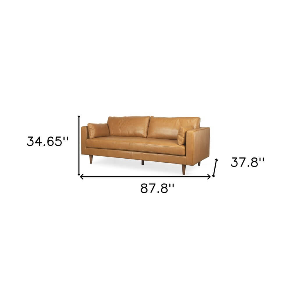 88" Tan Leather Sofa And Toss Pillows With Brown Legs dimensions 87.8" x 34.65" x 37.8"