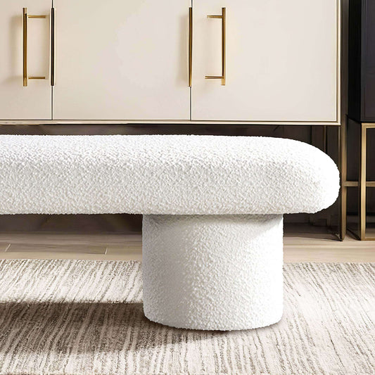 Randolph Ivory Boucle Bench 56' in modern living room with minimalist design and sleek cylindrical legs.