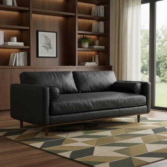 89" Black Leather Sofa With Brown Legs in modern living room setting with patterned rug.