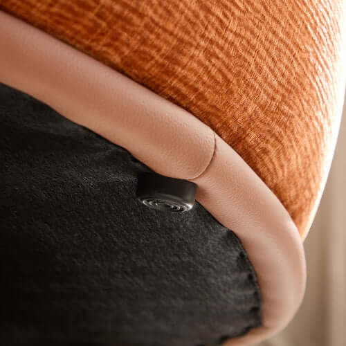 Detail of rounded edge and fabric texture of orange L-Shaped chaise sofa sectional, showcasing premium materials.