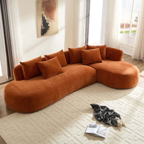 Rounded L-Shaped Chaise Sofa Sectional in bold orange with plush cushions, perfect for modern living spaces.