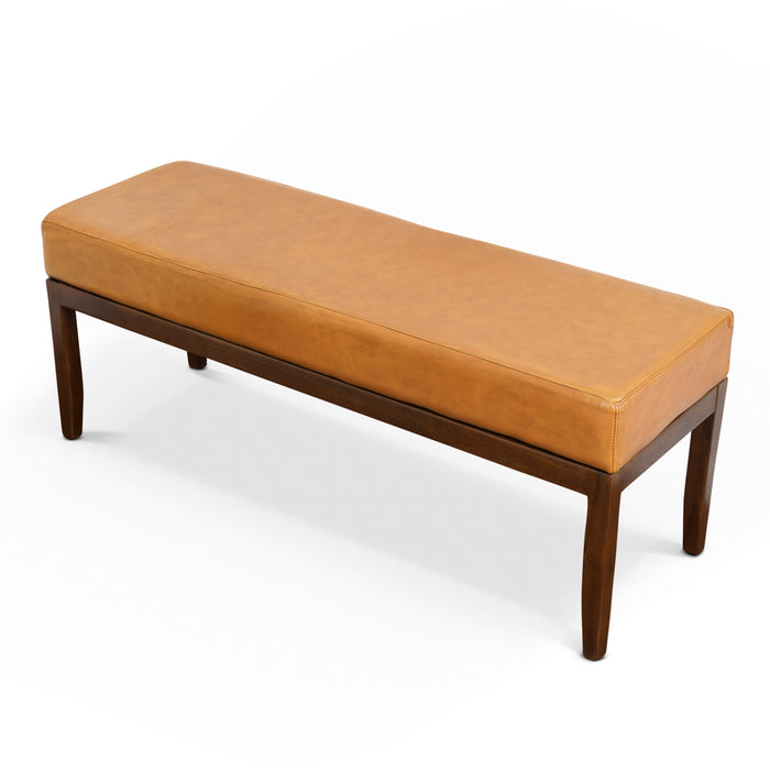 The Austin MCM Genuine Leather Bench 51 by Ashcroft Furniture features a rectangular design with a light brown genuine leather cushion and dark wood legs, displayed against a white background.