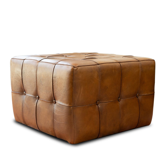 The Benjiro Button Tufted Square Leather Ottoman 27 by Ashcroft Furniture Co features a brown leather mid-century modern design with visible stitching, button tufting, and a smooth surface, shown on a white background.