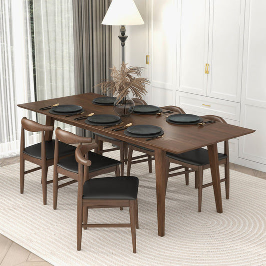 Levi MCM Walnut Dining Table – Rectangular Solid Wood Table (3 Sizes, 2 Colors) set for a meal with black plates and chairs.
