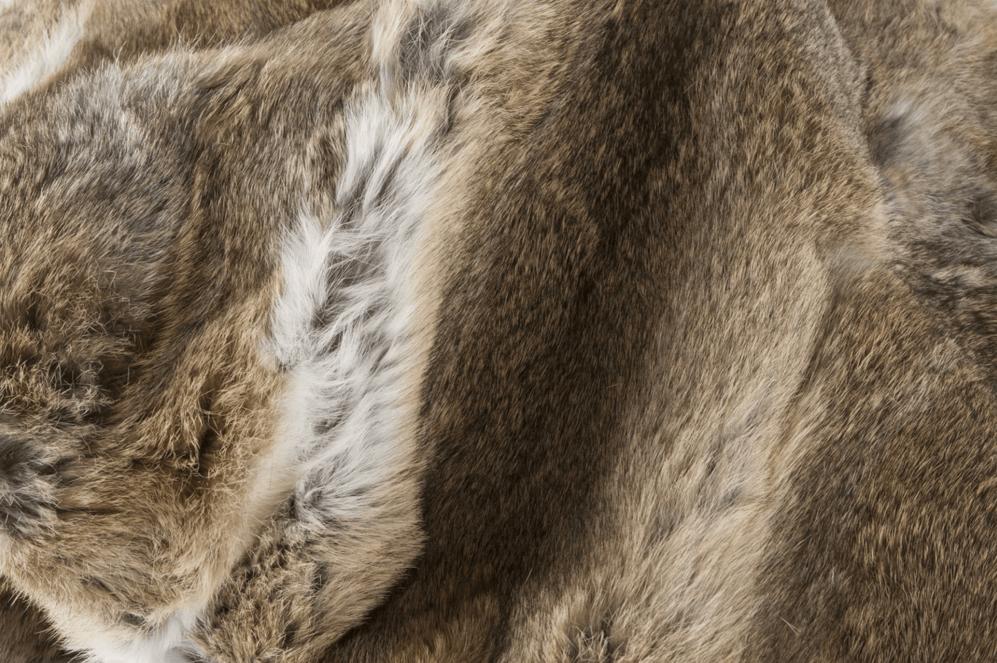 Close-up of the Home Roots Gray Rabbit Fur Throw Blanket, featuring genuine rabbit fur with mixed textures and natural patterns—its chic knitted design adds cozy style and warmth to any space.
