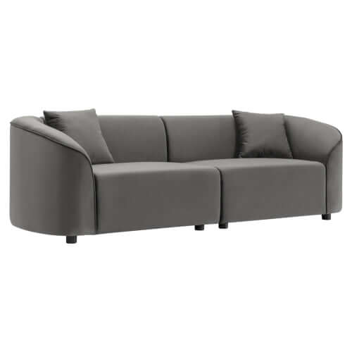 Contemporary sloped arm boucle upholstered sofa in gray with plush cushions, showcasing a sculptural curved design.