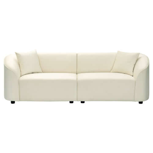 Contemporary sloped arm boucle upholstered sofa in cream color, featuring a sculptural curved design and plush cushions.