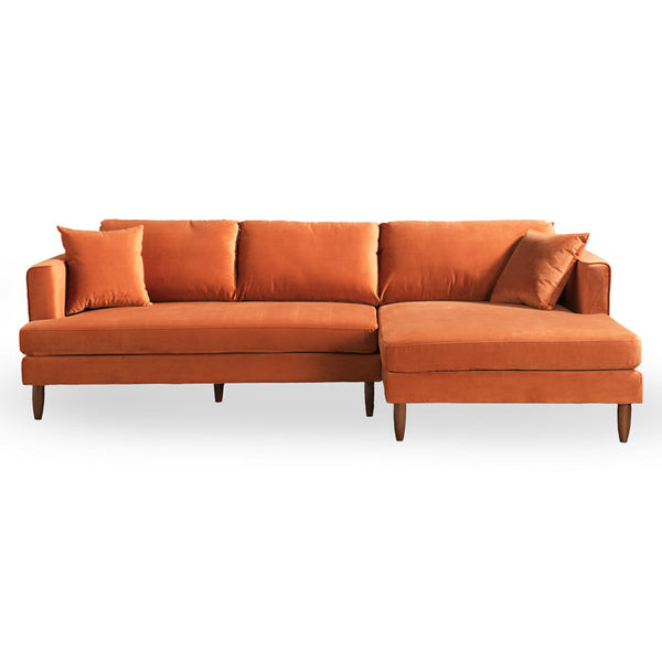 The Blake Velvet Upholstered L-Shape Chaise Sofa Sectional 107 by Ashcroft Furniture is a modern orange sofa with wooden legs, right-side chaise lounge, two matching square cushions, and a clean, minimalist design.