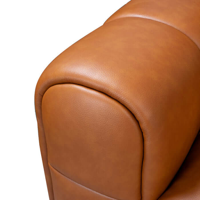 Close-up of cognac PU leather upholstery on Clark Tufted RF Chaise Sofa, showcasing its luxurious texture and craftsmanship.