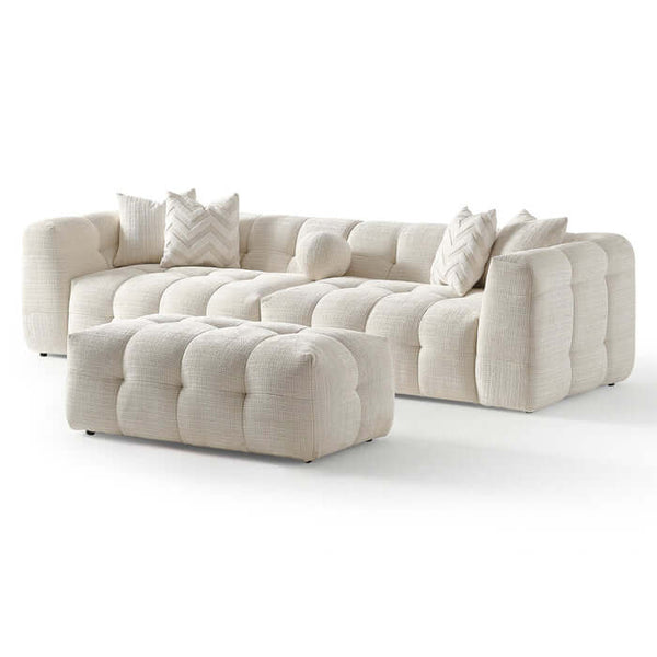 Alana Tufted Ivory Chenille Modular Sofa with Ottoman showcasing plush tufted design and cozy pillows.