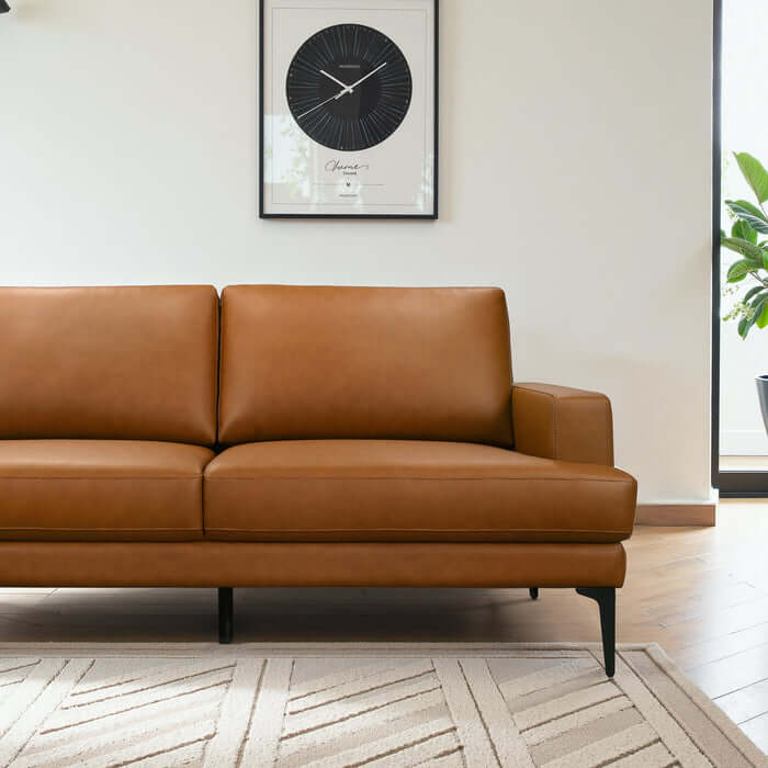 Bristol Vegan Leather Left-Facing Chaise Sofa Sectional in a stylish living room setting.