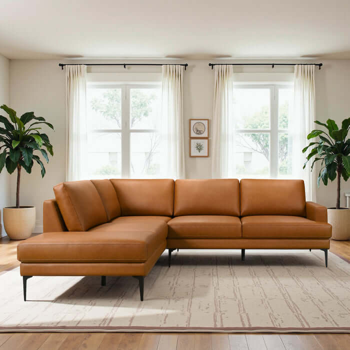 Bristol Vegan Leather Left-Facing Chaise Sofa Sectional in a stylish living room with plants and natural light.