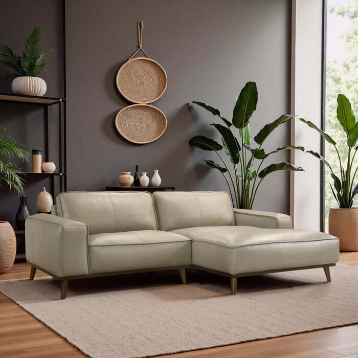 Kerrville beige leather right-facing chaise longue sectional sofa in a modern living room setting.