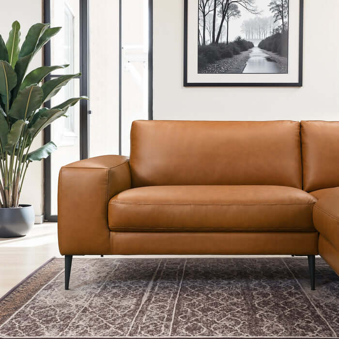 Easley MCM Vegan Leather Wide-Arm Sofa in rich brown, featuring sleek design and complementing decor.