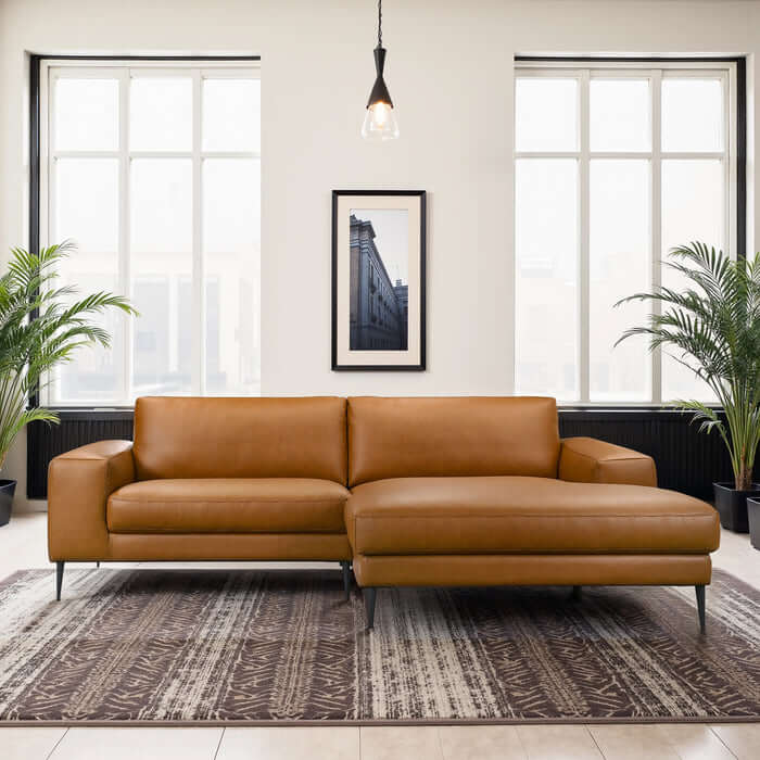 Easley MCM Vegan Leather Wide-Arm Chaise Sofa 98" in a modern living room with large windows and decorative plants.