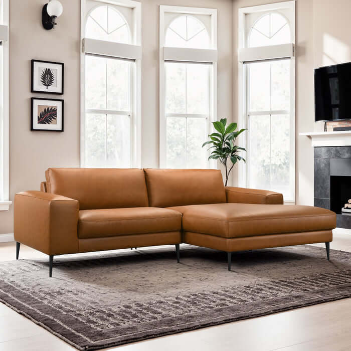 Easley MCM Vegan Leather Wide-Arm Chaise Sofa 98" in a stylish living room with large windows.