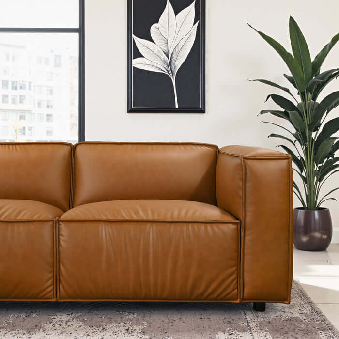 Findlay Vegan Leather Corner Sofa Sectional 103" in modern living room with plants and artwork.