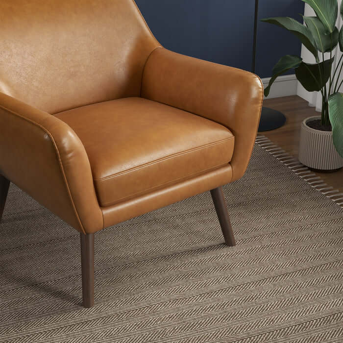 Panom MCM Tan Genuine Leather Lounge Chair showcasing sleek mid-century design and luxurious comfort in a stylish living room setting.