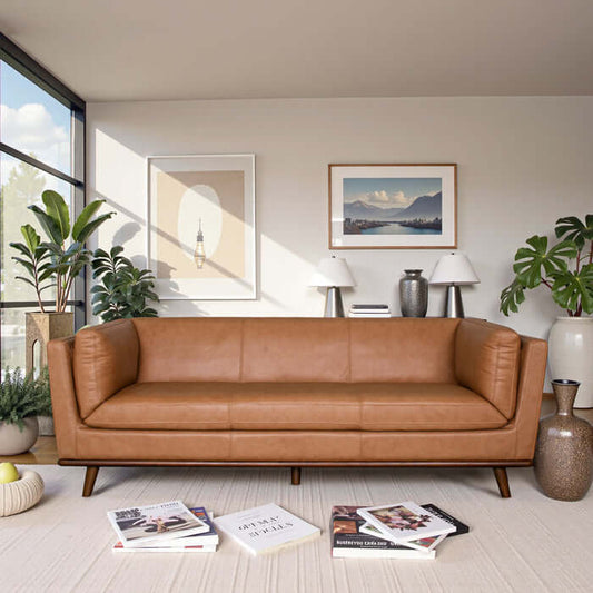 Phoenix MCM Premium Leather Sofa 86W in a modern living room setting with plants and decor.