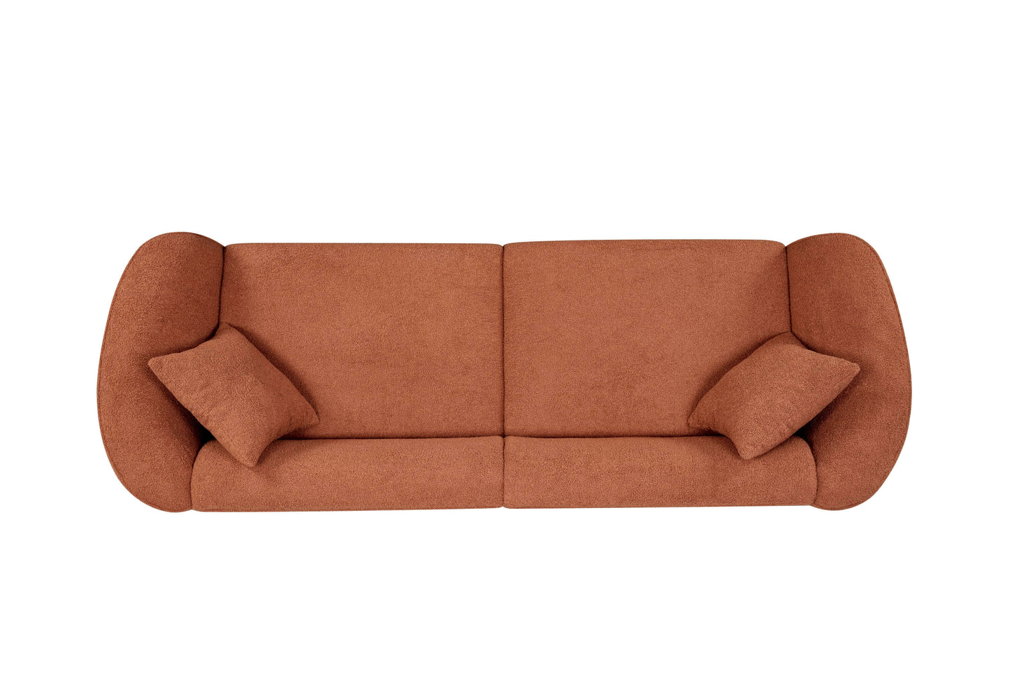 Modern sloped arm boucle upholstered sofa in warm terracotta color, showcasing bold curves and plush cushions.