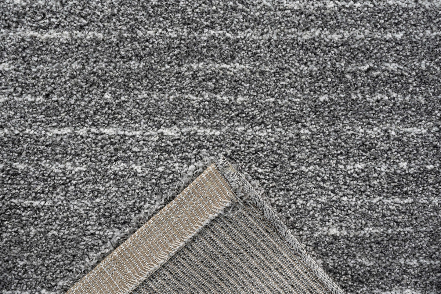 Lydia Rectangular Gray & White Striped Polypropylene Area Rug (3 Sizes) close-up showing texture and edge detailing.