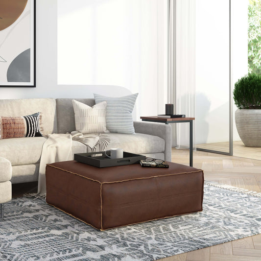 Brody Large Square Faux Leather Ottoman 36" – Coffee Table Ottoman (2 Colors) in a modern living room setting.