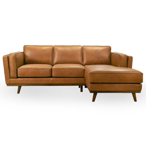 The Ashcroft Furniture Chase MCM Tan Leather Chaise Sofa Sectional 92 features three seat cushions, a right-side chaise lounge, angled armrests, and wooden legs in a mid-century modern style, all set against a white background.