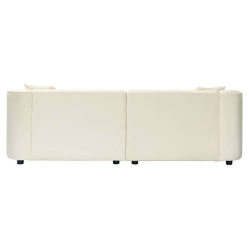 Sleek white boucle upholstered sofa with sloped arms, showcasing its modern back design and clean lines.