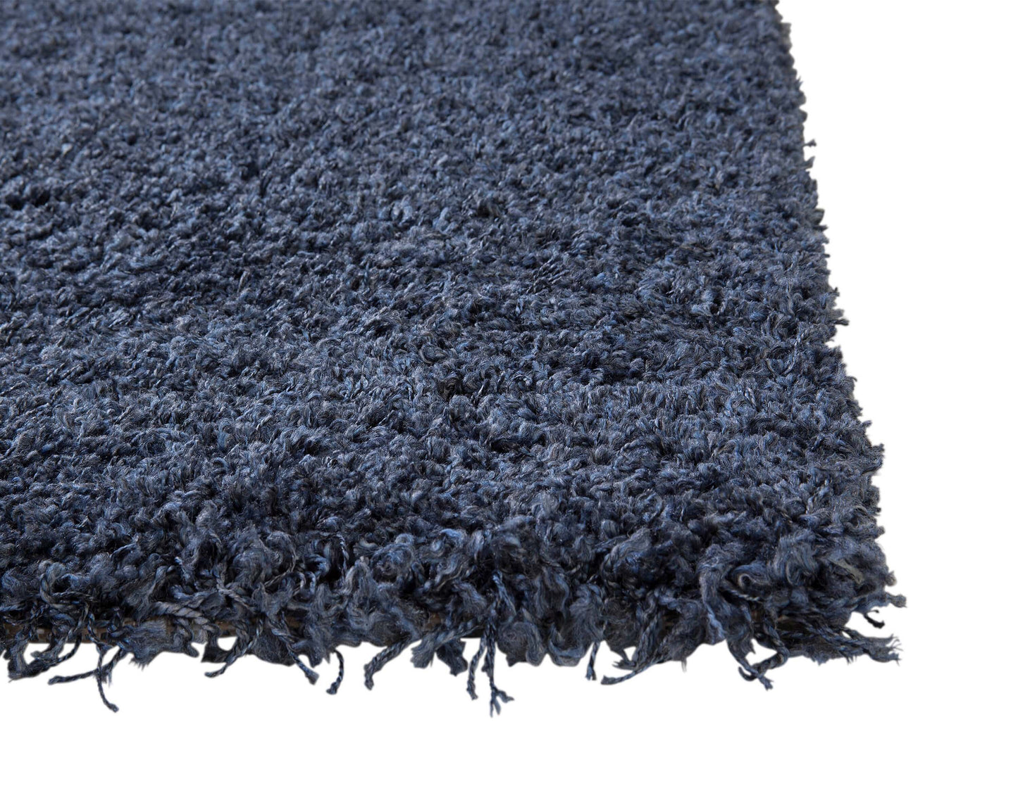 Slate blue rectangular shag area rug corner, showcasing plush texture and deep blue color, perfect for cozy spaces.