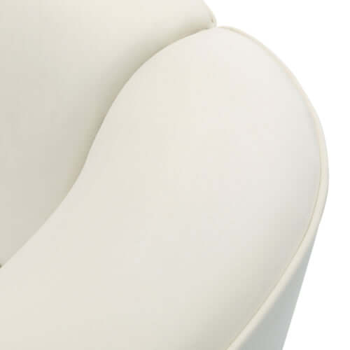 Close-up of the soft, sculptural arm of a contemporary upholstered sofa in a luxurious bouclé fabric.