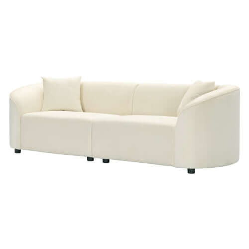 Contemporary sloped arm boucle upholstered sofa in cream, showcasing bold curves and luxurious comfort, ideal for modern interiors.