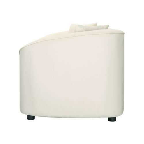 Contemporary sloped arm boucle upholstered sofa in cream, showcasing its sculptural design and plush cushions.