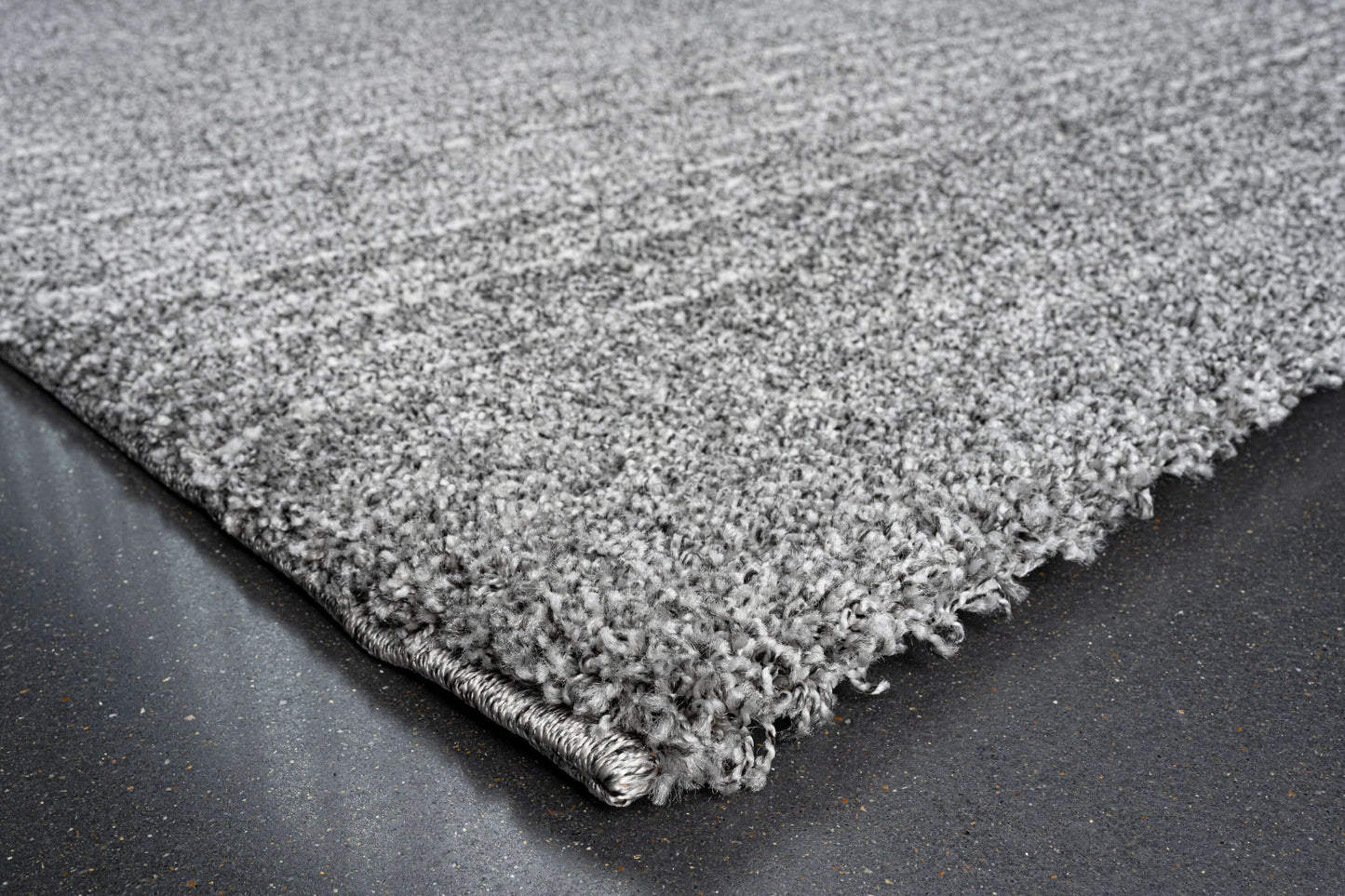 Lydia Rectangular Gray & White Striped Polypropylene Area Rug (3 Sizes) showcasing plush texture and contemporary design.