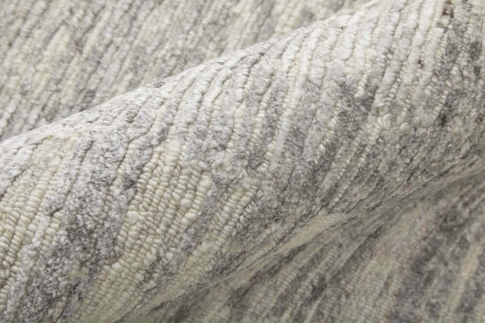 9' X 13' Ivory And Gray Abstract Hand Knotted Distressed Area Rug texture detail in plush fibers.