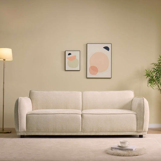 Oslo Boucle Sofa – 84” Round Arm Modern 3-Seater Couch (Beige Upholstered) in a stylish living room setting.
